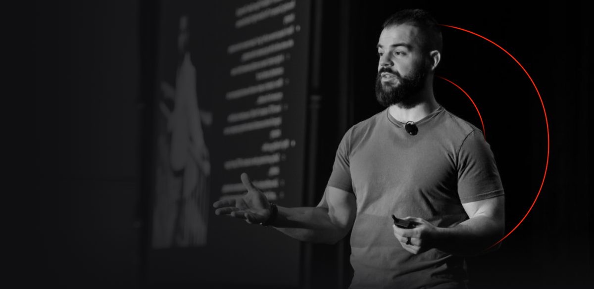 Cole Gordon, founder of Remote Closing Academy, speaking at a business event